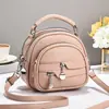 Bolsas de mujer Taizhou 2026 nuevo modelo bolsa redonda pequeña, bolso de hombro, bolso cruzado, bolso casual versátil, bolsa de manzana, venta directa de fábrica
