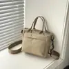 Bolsa de Tecido de Nylon Simples Transfronteiriça para Mulheres 2026 Versão Coreana Nova Bolsa de Mão de Grande Capacidade Bolsa de Ombro Transversal Bolsa Tote