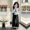Novo Top Chique Estiloso de Manga Curta para Meninas, Conjunto de Duas Peças com Calça Wide-Leg Patchwork Xadrez de Personalidade Casual, Tendência