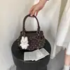 Bolso pequeño súper popular para mujer, nuevo modelo de verano 2026, bolso tipo cubo de hombro y cruzado de alta gama para el día a día