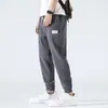 Calça Casual Masculina de Seda Gelada Nove Pontos Calças Masculinas Verão Fina Estilo Hong Kong Tendência Esportiva Perna Larga Respirável Calças de Verão
