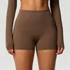 En stock shorts de yoga de color sólido a doble cara cepillados de cintura alta ajustados que realzan los glúteos para mujer, adecuados para correr y actividades de fitness