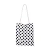 Bolsa de lunares de nicho súper popular estilo coreano para mujer 2026 Nueva bolsa versátil de un solo hombro para llevar debajo del brazo Bolsa pequeña de mano para salir a trabajar