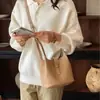 Bolso pequeño súper popular para el trabajo, nuevo bolso de hombro para mujer 2026 otoño nicho para ir al trabajo, bolso bandolera tipo cubo
