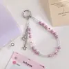 Cadena para teléfono de perlas con colgante de estrella estilo Ins, correa de muñeca floral dulce, accesorio para bolso, suministro al por mayor