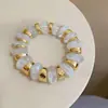 Pulsera elástica de resina degradada transfronteriza europea y americana, Pulsera de muñeca estilo vintage Maillard, Lujo ligero, Sensación de alta gama, Joyería de mano minimalista al por mayor