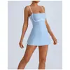 Mono de yoga transfronterizo para mujer, diseño de bloques de color con copas incorporadas en el pecho, falda de tenis con forro anti-exposición, vestido tipo tank top deportivo para fitness