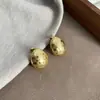 Pendientes Artesanales con Textura Martillada en Forma de Huevo para Mujer Accesorios de Lujo Accesible Europeos y Americanos Diseño de Nicho Pendientes de Plata con Aguja Retro de Gama Alta Pendientes