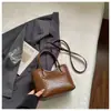 Bolsa de balde com textura tramada cruzada feminina 2026 nova moderna estilosa versátil bolsa de ombro único transversal bolsa de mão com toque de alta qualidade