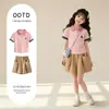 Moda de Verano 2026 Estilo Universitario Nuevo y Moderno Conjunto de Dos Piezas de Pantalones Cortos Sueltos Casuales de Manga Corta para Niñas Mayores