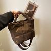 Color sólido lazo simple 2023 Invierno nuevo gran capacidad hilo bordado Cuadros bolso espacial ropa acolchada bolso de hombro para mujer