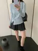 Camiseta chic de diseño coreano con torsión y manga larga para mujer, nueva para primavera y otoño, cuello redondo, ajuste ceñido, top básico