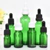 Suministro directo botella de aceite verde de 10 ml botella con gotero de 15 ml subenvasado de solución madre cosmética botella de vidrio oscuro
