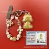 Llavero de tela con logo de empresa personalizado Cadena para teléfono móvil Angela Lámina de oro puro Oro 999 Regalo de aniversario