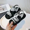 Sandálias Infantis Estilo Fada 2026 Verão Novo Sandálias de Princesa para Meninas Sapatos Romanos com Laço Sandálias de Praia para Meninas