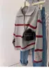 Suéter de lana pura a rayas con cuello polo y media cremallera para mujer, estilo perezoso, jersey de punto, sudadera de punto, nuevo estilo 2025