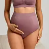 Pantalones de maternidad sin costuras de tiro alto, diseñados para dar soporte al abdomen durante el embarazo y el posparto, disponibles en tallas grandes, transpirables, muy elásticos y con un ajuste que abraza las caderas sin apretar y sin marcar la ropa interior.