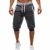 Pantalones cortos deportivos casuales de moda para hombres europeos y americanos, ajustados, de cinco puntos, a juego con el color, para correr y hacer ejercicio.