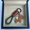 Dinero en el Caballo Cuero de Vaca Creativo Exquisito Casual Regalo de Pareja Bolso Lindo Colgante Llavero de Coche Llavero