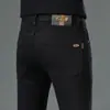 Pantalones vaqueros de marca de alta gama y tendencia de Hong Kong para primavera y otoño, pantalones ajustados elásticos negros bordados, pantalones casuales estilo coreano