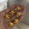 Jingqiao Aretes de acero inoxidable con forma de estrella de mar dorados estilo europeo y americano aretes de alta gama para Instagram aretes de acero de titanio aretes transfronterizos