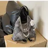 Bolso grande de mujer popular transfronterizo, moderno y de alta gama, con detalle de lazo, mochila de un solo hombro y de doble hombro, bolso de axila de diseño nicho