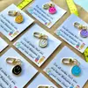 Llavero de cara sonriente de color aleación con goteo transfronterizo de comercio electrónico, accesorios de colgante para bolso con expresión irregular chapado en oro