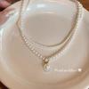 Collar de doble capa de perlas retro francesas, accesorios para mujer, pequeñas cuentas de arroz, gargantilla de cadena de clavícula de lujo ligero y de alta gama.