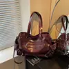 Bolsa de moto nicho e estilosa estilo coreano para mulheres, nova bolsa tote tendência 2026 com múltiplos bolsos, estilo ombro e transversal