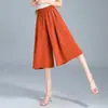 Calças cropped elegantes e fluidas de perna larga para mulheres, com um design inspirado na China, um visual jovial, cintura elástica com cordão e um efeito emagrecedor.