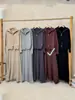 Nuevo Conjunto de Dos Piezas para Mujer Otoño/Invierno 2026: Cárdigan de Punto con Cuello Solapa y Doble Cremallera + Falda de Cintura Alta Estilo Casual