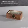 Caja de almacenamiento de joyería de madera maciza engrosada con diseño de compartimentos de lujo ligero para organizar aretes, collares y anillos