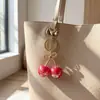 Chaveiro de resina doce cereja com laço e glitter fino, pingente de fruta, acessório para bolsa, Amazon transfronteiriço