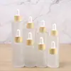 Botella de Vidrio Transparente para Aceite Esencial con Anillo de Imitación Madera Gotero Botella Esmerilada Botella Vacía Reempaquetada Botella Cosmética Venta al por Mayor en Stock