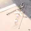 Nuevo llavero con lazo acrílico, colgante con personalidad, colgante para bolso, funda para auriculares, cadena, joyería