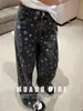 Bienes Nanyou de Shenzhen~25 Nueva Colección Otoño/Invierno: Jeans Anchos Estampados Negros para Mujer Estilo Chanel