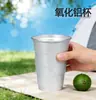 Vaso de aluminio para acampar al aire libre Vaso de Coca-Cola Vaso de alúmina Bebida fría escalonada reciclable Vaso de aluminio con logotipo impreso en metal