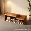 Banqueta gris minimalista italiana con zapatero de niveles de estilo abierto y asiento tapizado, una banqueta multifuncional para la entrada