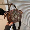 Bolso Redondo Pequeño de Moda de Gama Alta para Dama 2026 Nuevo Bolso de Mano con Estampado Retro Bolso Cruzado de Hombro Único Versátil Casual