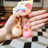 Popular Reino de Rock caricatura pato que cambia de color Gigi peluche llavero colgante muñeca que cambia de color regalo de pareja
