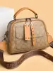 Bolso de Mano Versátil con Estampado Retro Texturizado de Gama Alta para Mujer 2025 Nuevo Elegante Bolso Cruzado de Hombro de Nicho para Viajes Diarios