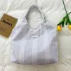 Shuai Mijia 2026 Verão Nova Bolsa de Mão Listrada Estilo Ins Simples e Estilosa Bolsa Tote Portátil para Lancheira para Mulheres