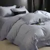 Nuevo juego de ropa de cama de cuatro piezas de algodón de fibra larga cepillado, con 60 hilos, que ofrece una sensación lujosa y de alta gama, disponible en estilos de sábana plana, sábana ajustable y colcha de algodón puro