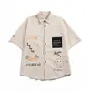 Nova Camisa de Manga Curta Cor Sólida Japonesa de Verão Masculina Solta Tendência Marca Fina Roupa de Trabalho Retrô Para Casais Camisa de Cinco Pontos Tendência