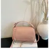 Bolso de mano minimalista de nicho transfronterizo para mujer, nuevo bolso tote pequeño casual para salir, bolso versátil de hombro y bandolera para el día a día