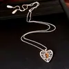 Collar con colgante de corazón hueco de circonita y ojo de tigre, lujo ligero con un toque de alta gama, cadena para la clavícula de estilo vintage, accesorio moderno y versátil