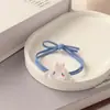 Bonita banda de goma transparente con forma de cabeza de perro de color jade y canela de Sanrio para pareja, accesorios para el cabello de dibujos animados coreanos para mejor amigo.