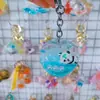 Nuevo Llavero de Botella de Arena Movediza de Durazno Muñeca Linda Colgante Decorativo para Bolsa de Regalo