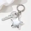 Venta Caliente Transfronteriza Dulce y Fresco Exquisito Moda Acrílico Lazo Forma de Corazón Estrella de Cinco Puntas Llavero Colgante para Mochila de Estudiante