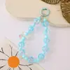 Cadena para teléfono de pastel transparente estilo Ins con cuentas pintadas a mano, mismo estilo que se ve en las transmisiones en vivo, colgante de llavero con cuentas, accesorio para bolso